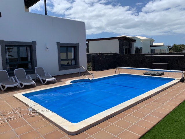 External View of Las Palmeras Blanca across the Pool