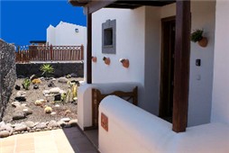 Entrance / Gardens to side