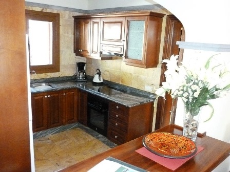 View across breakfast bar to Kitchen