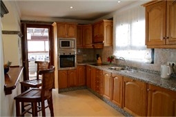 Fully Fitted Kitchen with Stools at Breakfast Bar