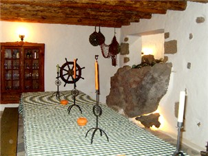 Large table and seating area in basement
